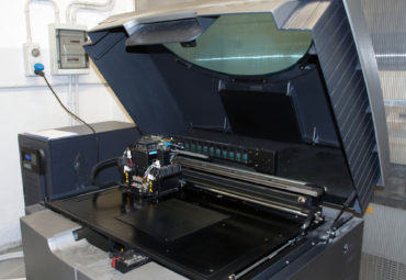 A polyjet printer ready to start printing. Want to understand the differences between a polyjet printer vs FDM? Here's a 3D printing technology comparison