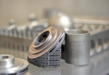 Object printed on metal 3d printer. A model created in a laser sintering machine close-up. DMLS, SLM, SLS technology. Concept of 4.0 industrial revolution. Progressive modern additive technology.