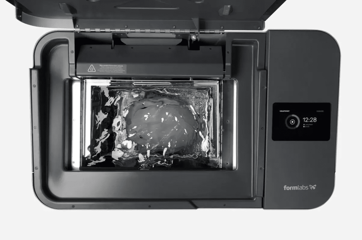 Image showing 3D printed helmet being washed in Form Wash L machine