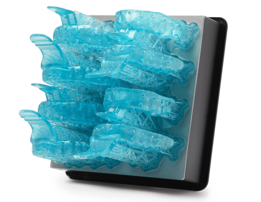 Image shows tray of SLA 3D printed custom dental trays