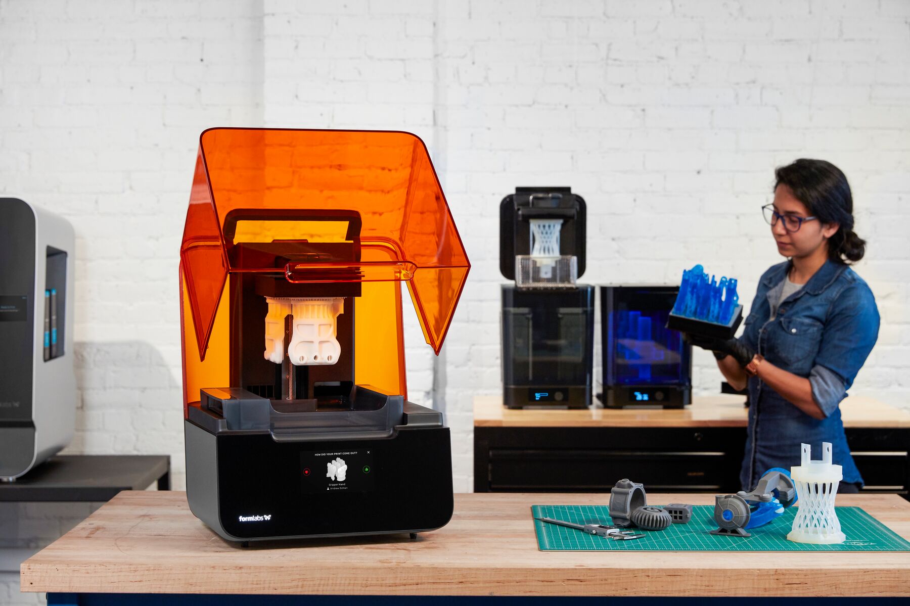 Image shows the SLA ecosystem from Formlabs with 3D printer, washing and curing machines