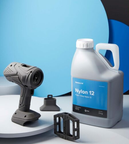 Image shows Formlabs' Nylon 12 SLS powder container and 3D-printed parts