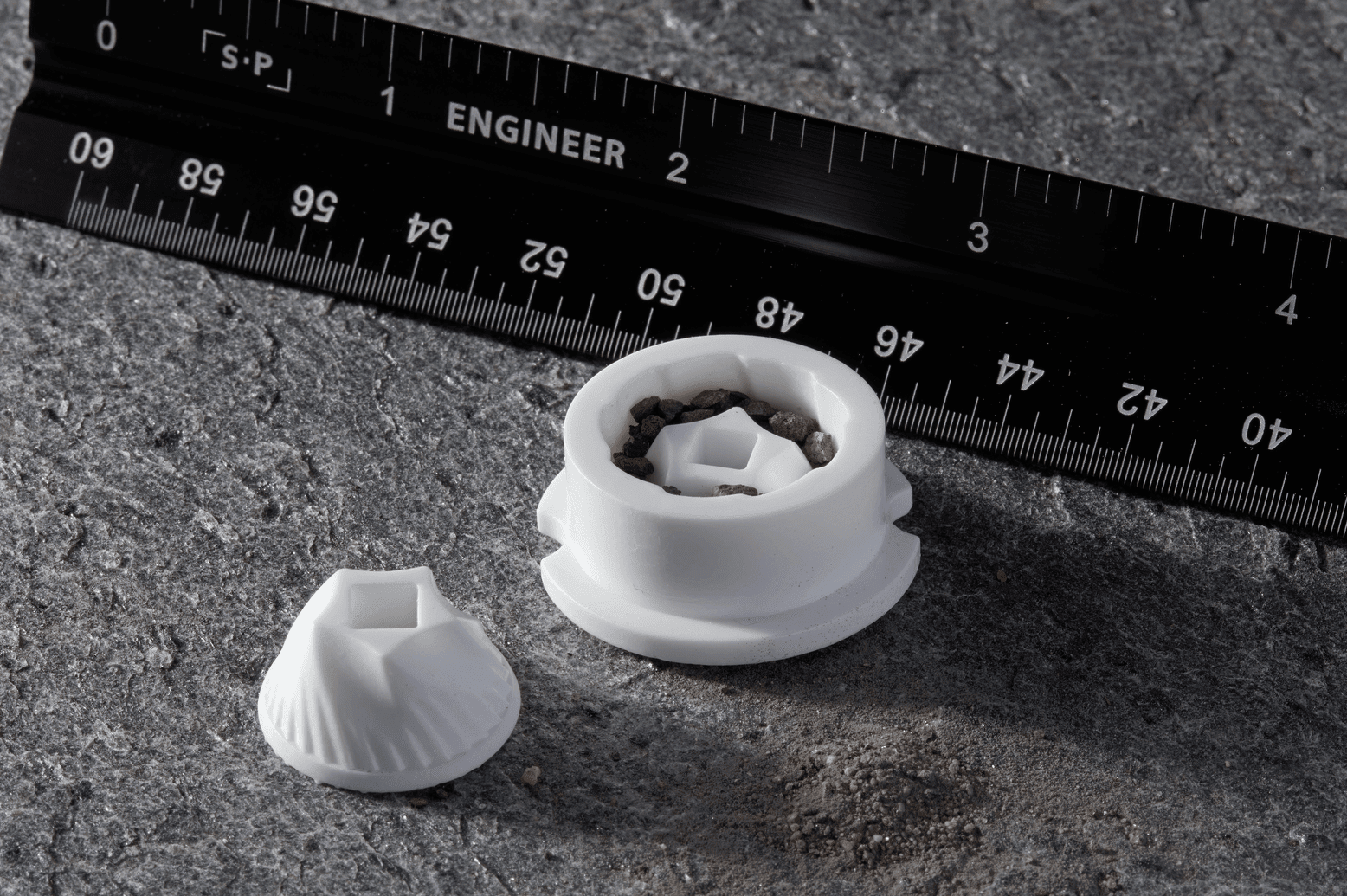 Image shows two 3D printed parts with Formlabs Alumina 4N ceramic resin