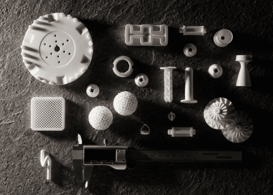 Image shows a multitude of 3D printed parts with Formlabs Alumina 4N ceramic resin 