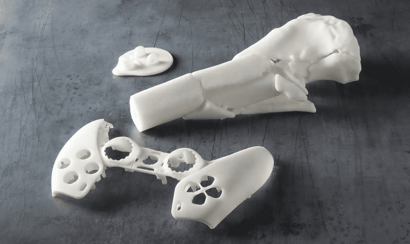 Image shows 3D printed parts with White V5 resin from Formlabs