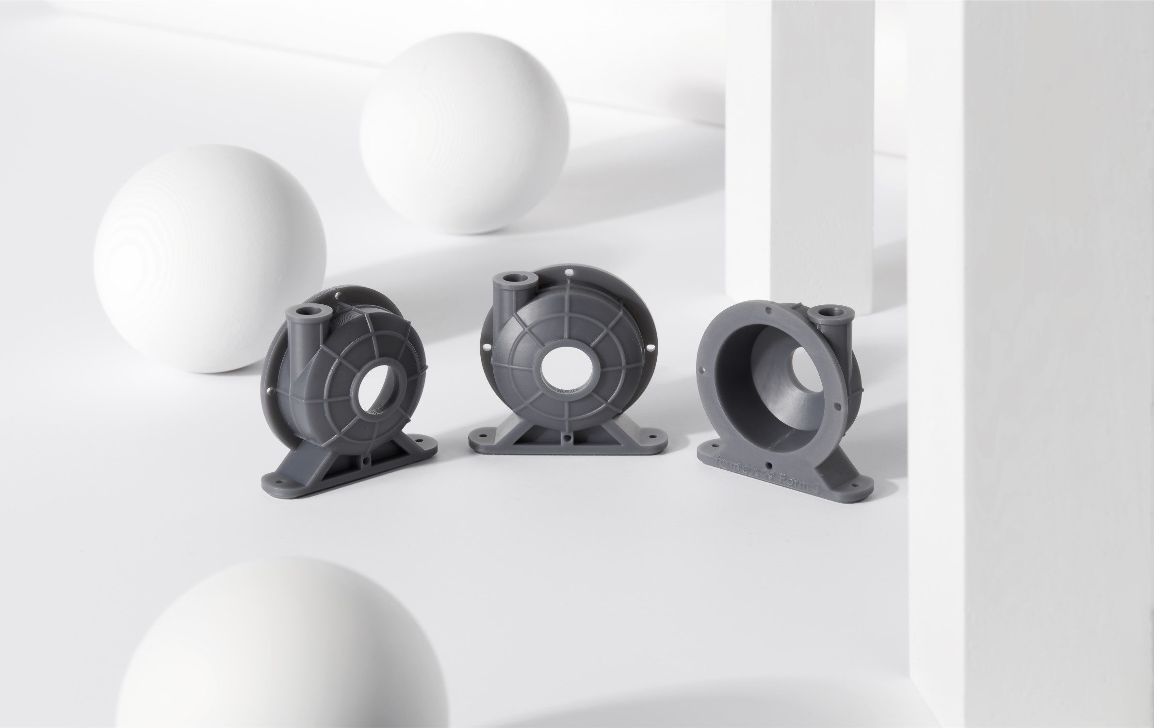 Image shows 3D printed manufacturing parts made with Formlabs Tough 2000 resin